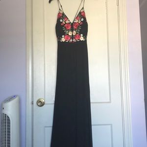 Black prom dress with a slit down the side.